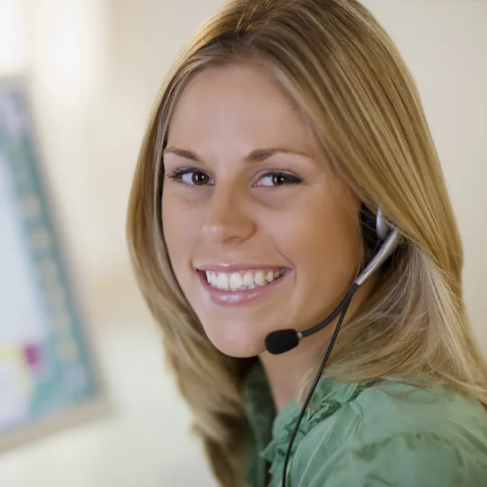 Women with headset on smiling