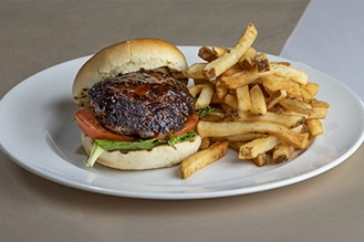 A photo of the Bistro Burger with a side of french fries.