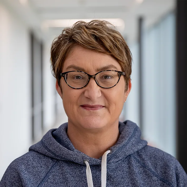 A headshot of Lee Ann Butler smiling