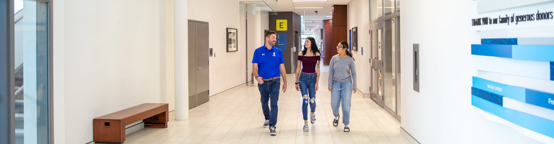 tour-guide-showing-students-around-campus Students getting a tour of Lambton College