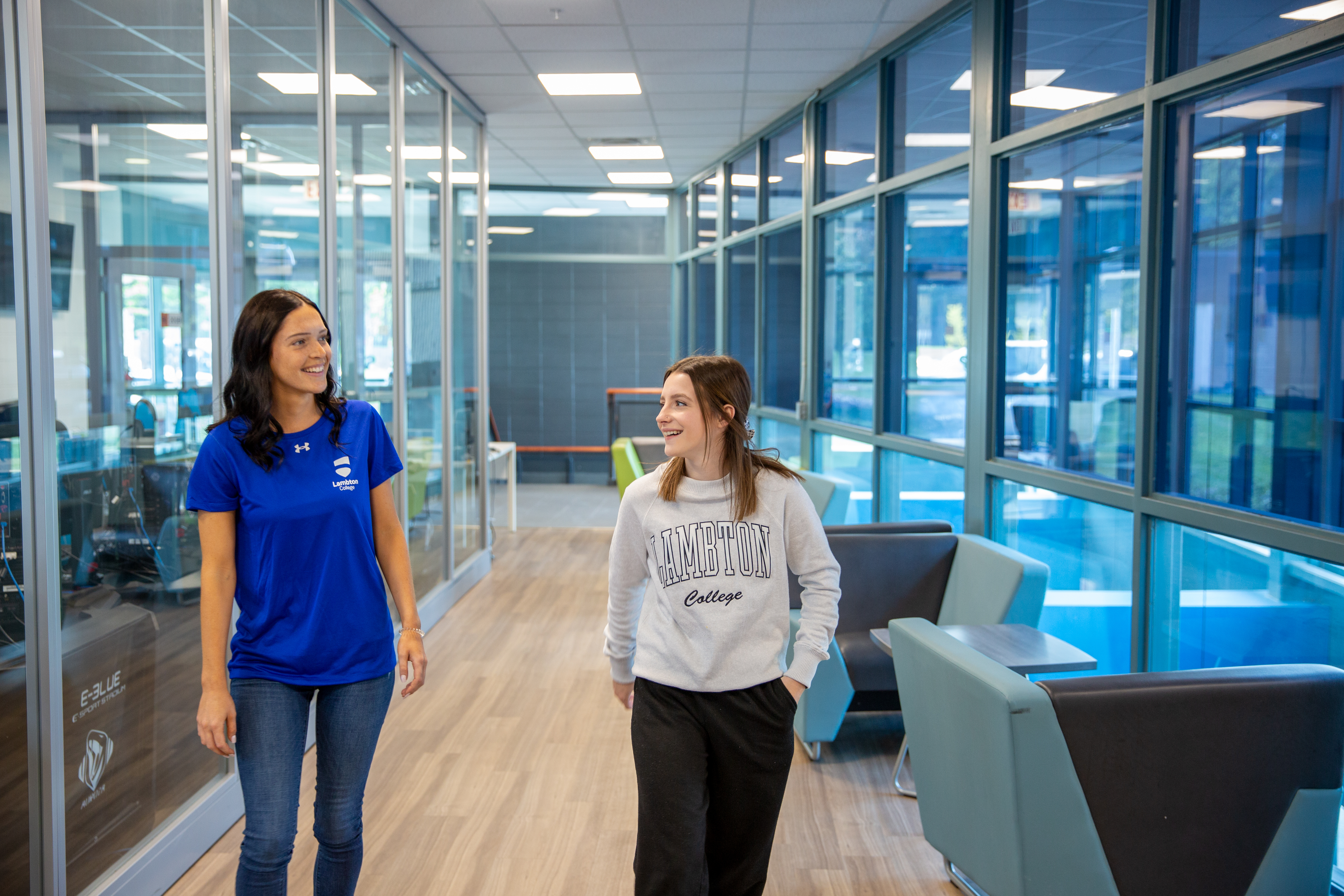 Recruiter and student walking in the hall