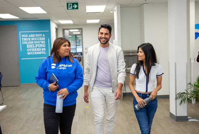 International students walking in a hallway.