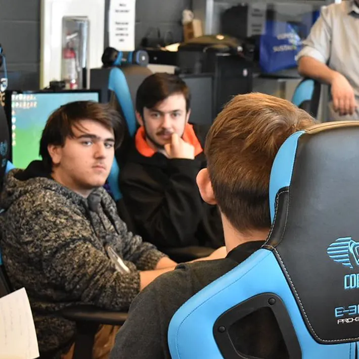 esea-students ESEA students sitting in gaming chairs.