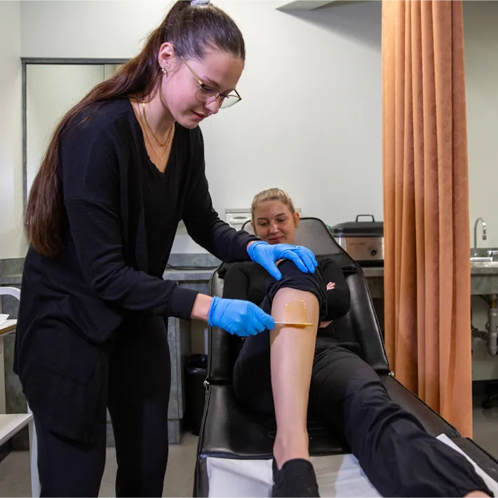 ESTH after graduation photo of student in spa and salon lab.