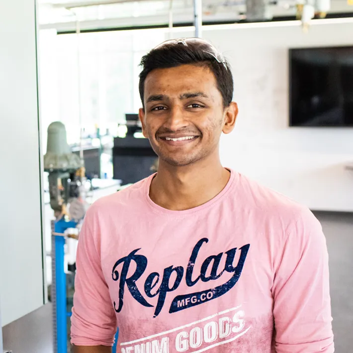 Student posing for photo in lab.