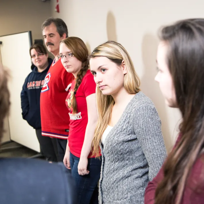 Students standing in classroom preparing for placement.