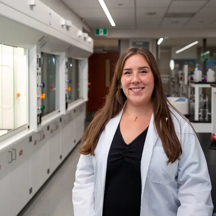 Ashley standing in the Water treatment lab