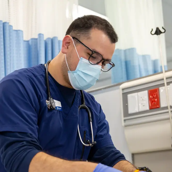 Nursing student working on a dummy patient