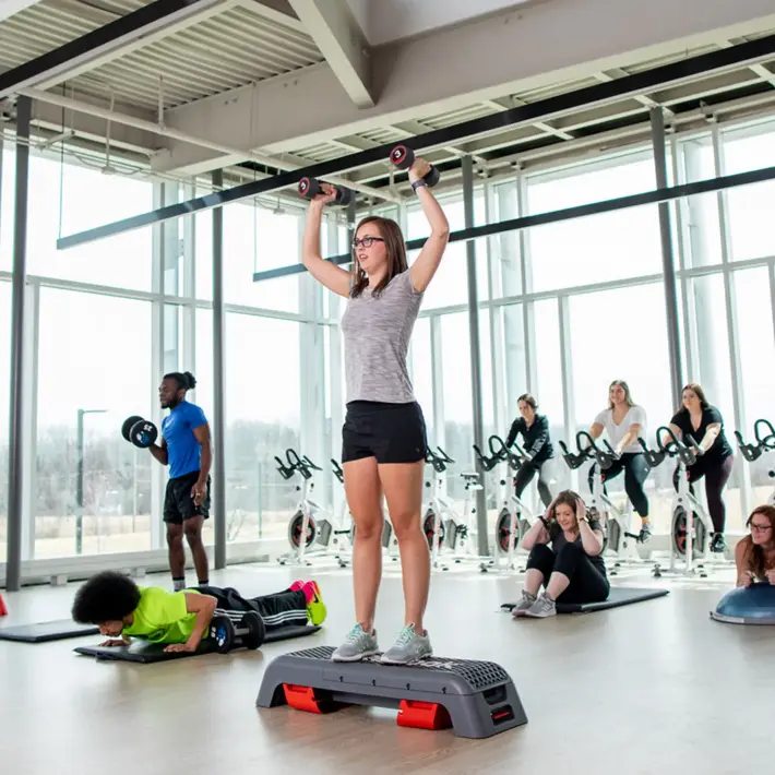 Group of students working out in the gym fitness centre