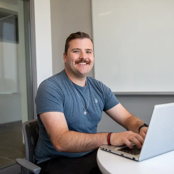 A student on a laptop in a study room
