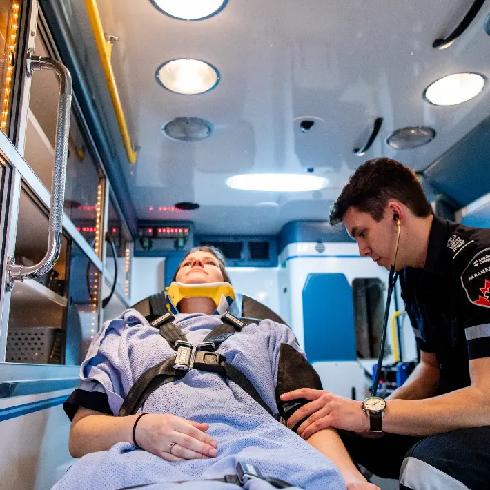 Paramedic students in ambulance lab