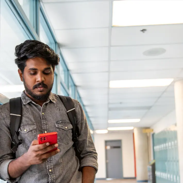 student-phone International student on his phone