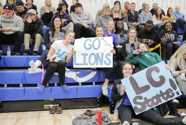 Students cheering on the Lions