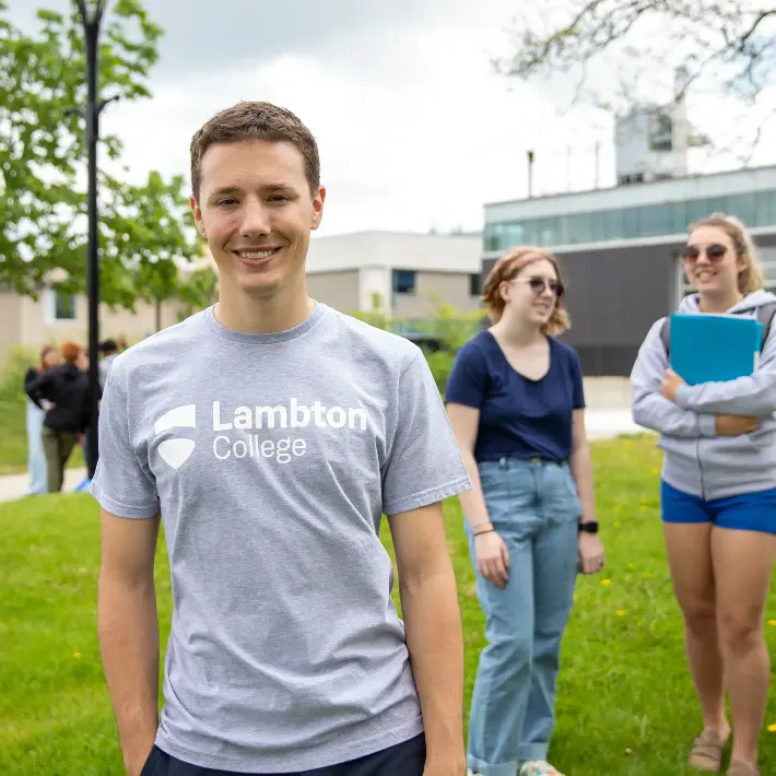 A group of students standing in front of the C1 entrance