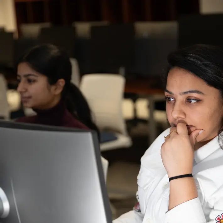 two-students-computer-lab Two students working in a computer lab