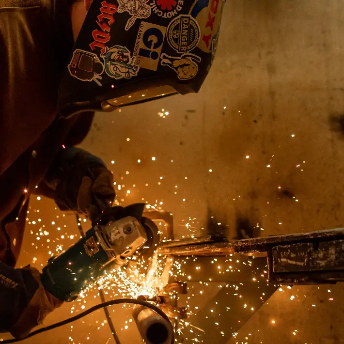 welding-workshop Welding student working while sparks fly
