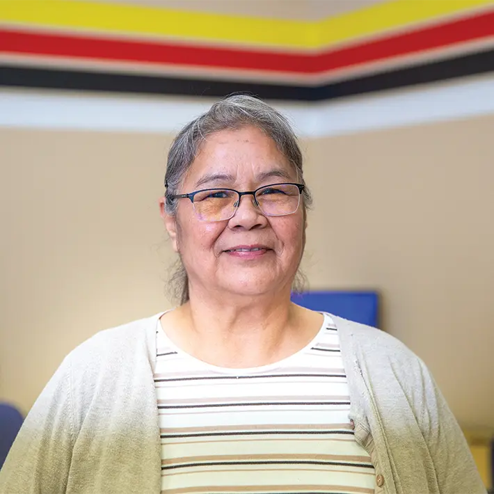 Indigenous support team member posing for photo.